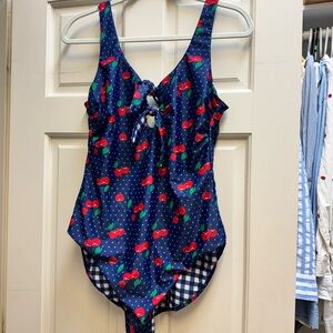 Reversible cherry print/navy gingham one piece bathing suit with front ties